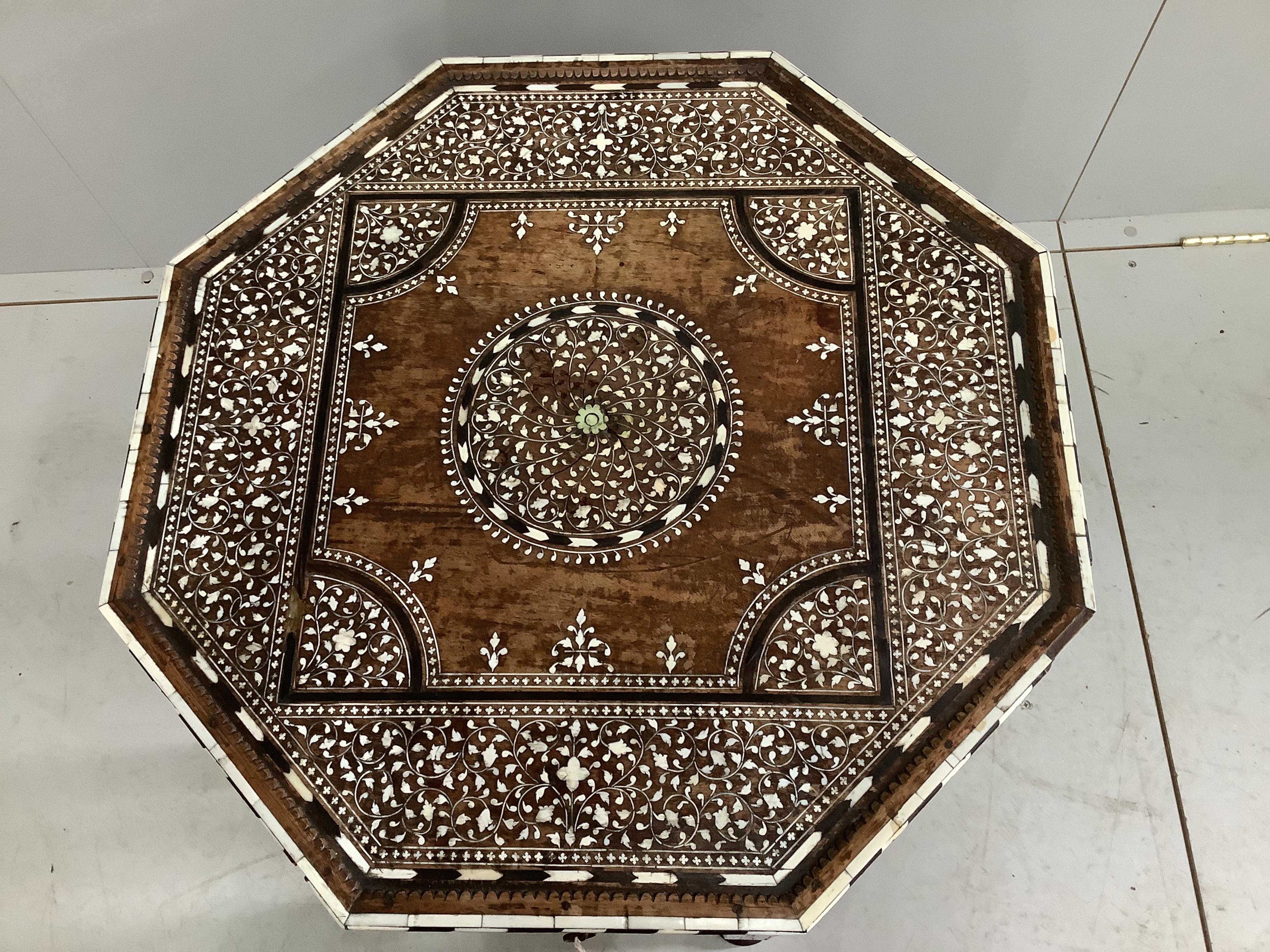 A 19th century Indian Hoshiarpur brass mounted octagonal bone inlaid table, fitted two drawers on turned legs, width 62cm, height 62cm